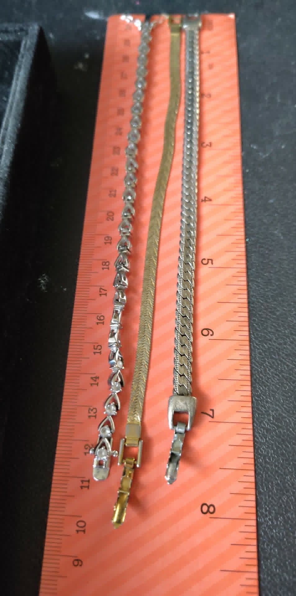4 gold & silver toned bracelets, one stretch