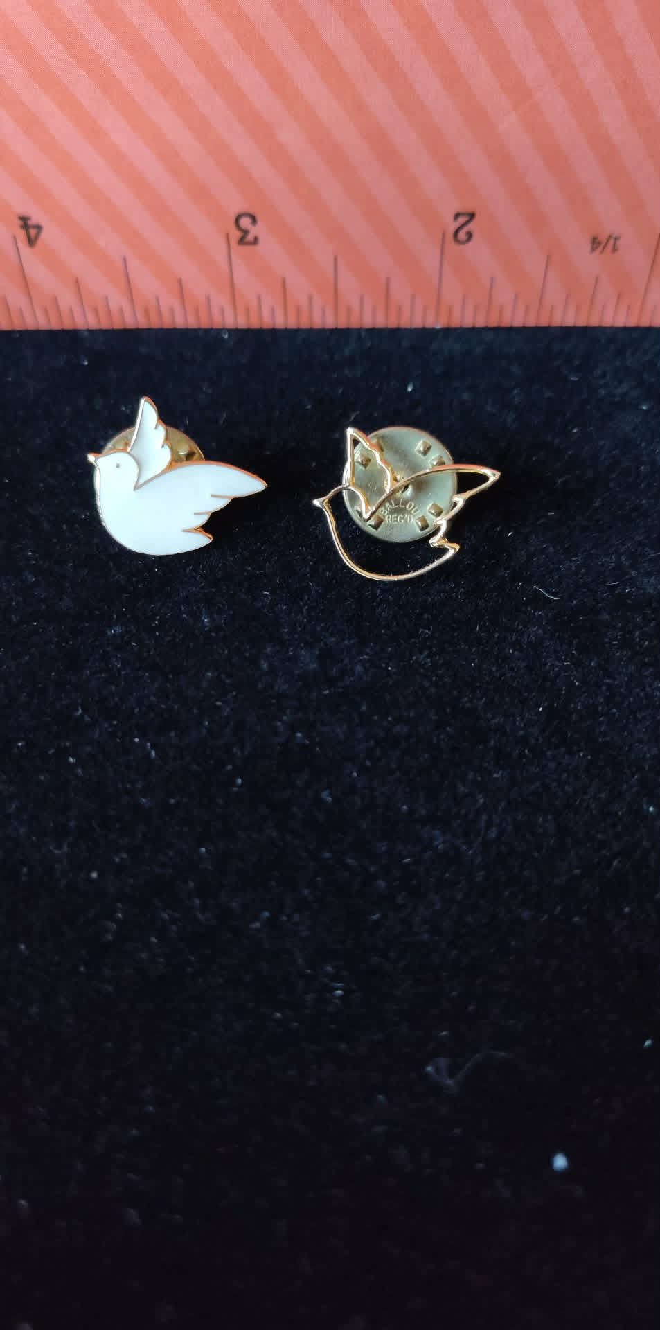 2 vintage dove pins, one white enamel & one gold-toned dove